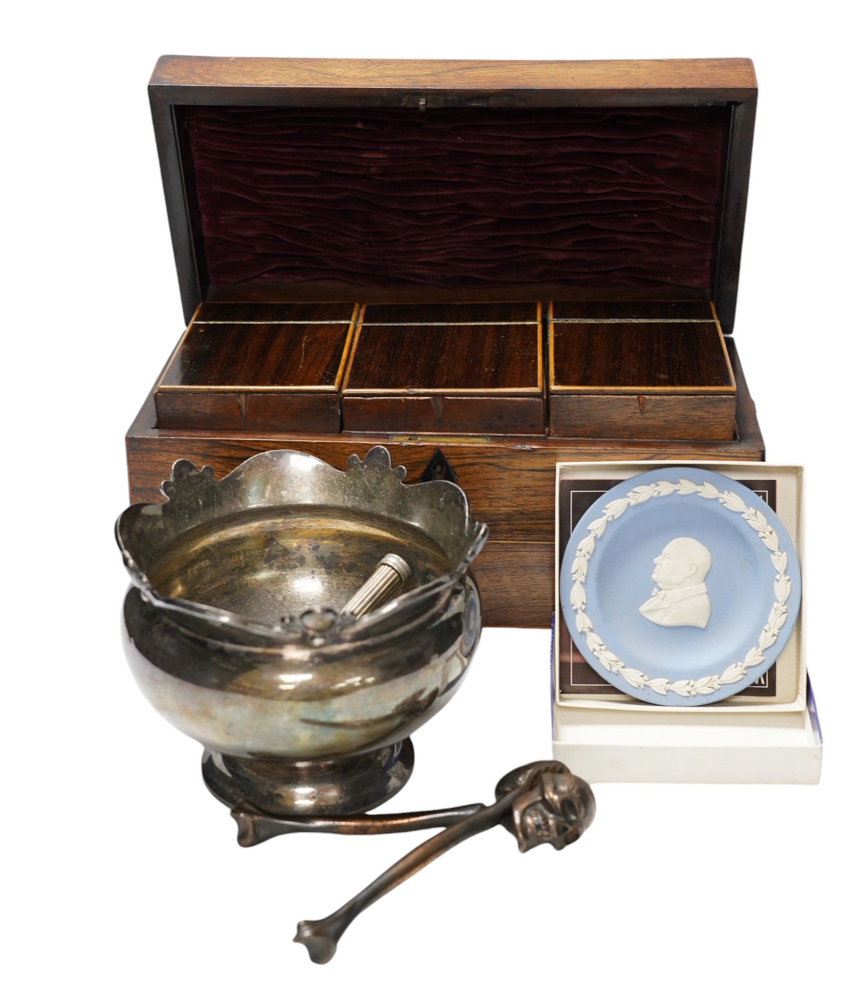 A Regency rosewood tea caddy, three pairs of nut crackers including a novelty skull nut cracker, a plated bowl, two napkin rings and a Wedgwood dish. Condition - varies